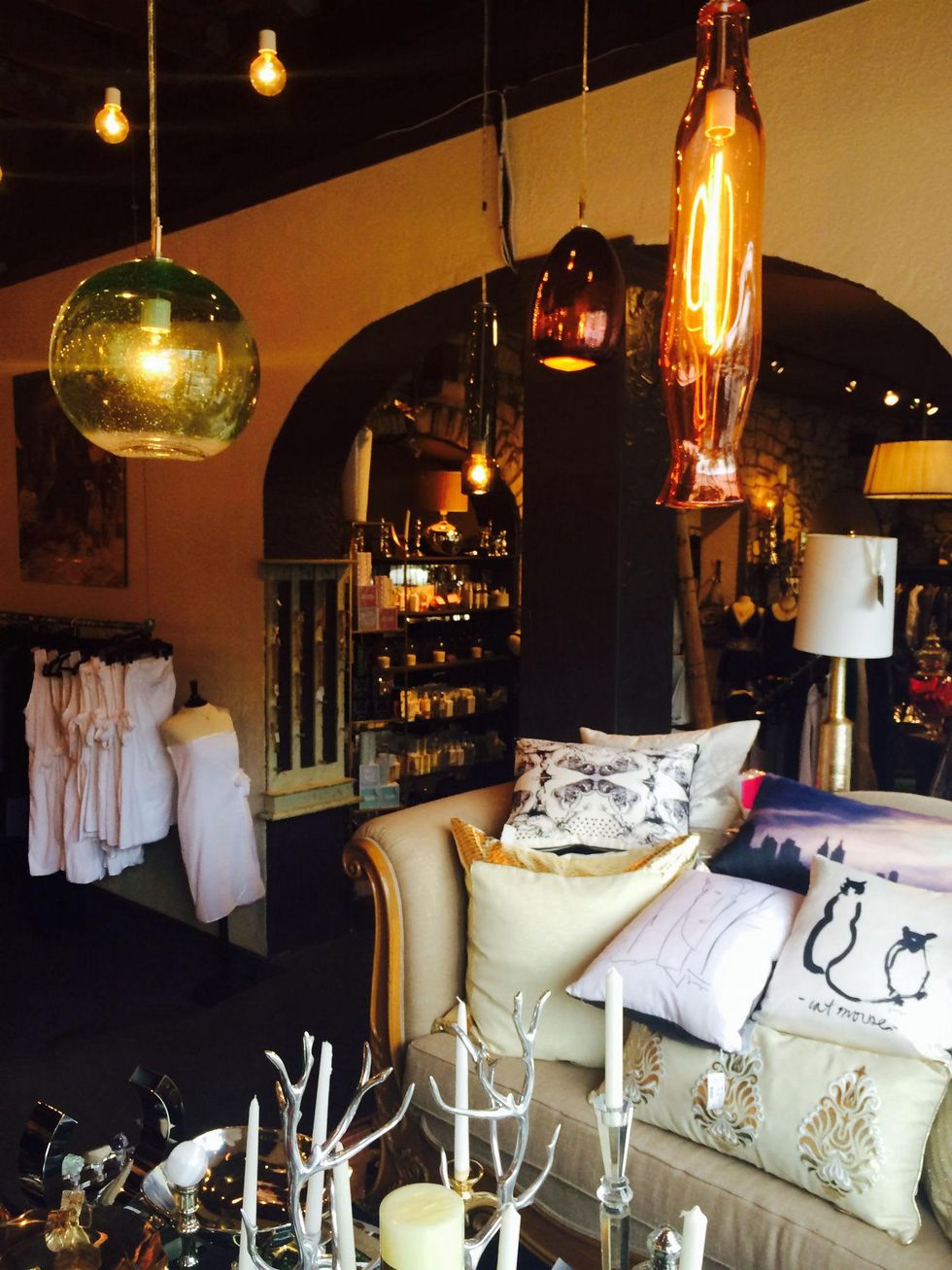 Lighting fixtures and pillows by Tempo Luxury Home at More Than You Can Imagine