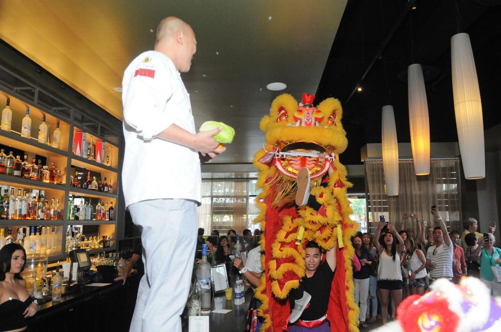 Lion Dancer performers with chef at the Curry Crawl May 2014
