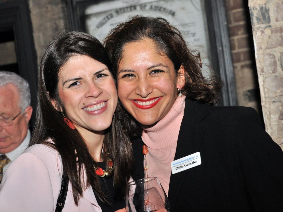 Lisa Uresti, left, and Otilia Gonzales at the Mayor's Hispanic Advisory Board Holiday Party December 2013