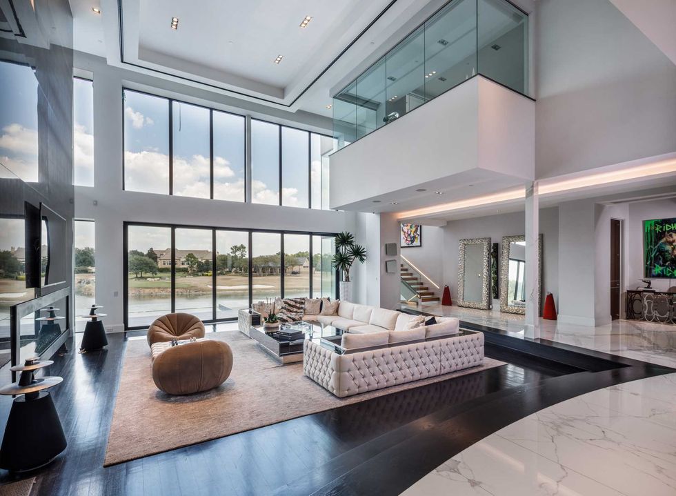 Living room of 3201 Noble Lakes Lane, overlooking the golf course of the Royal Oaks Country Club