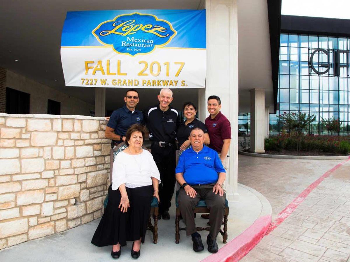 The López family with Jim "Mattress Mack" McIngvale. CultureMap Houston