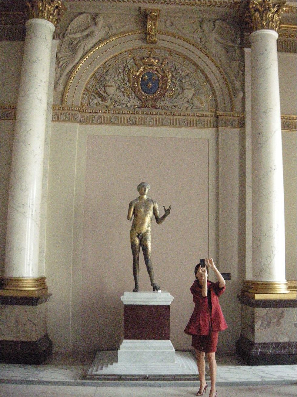 Louvre Paris tour July 2013 woman and statue