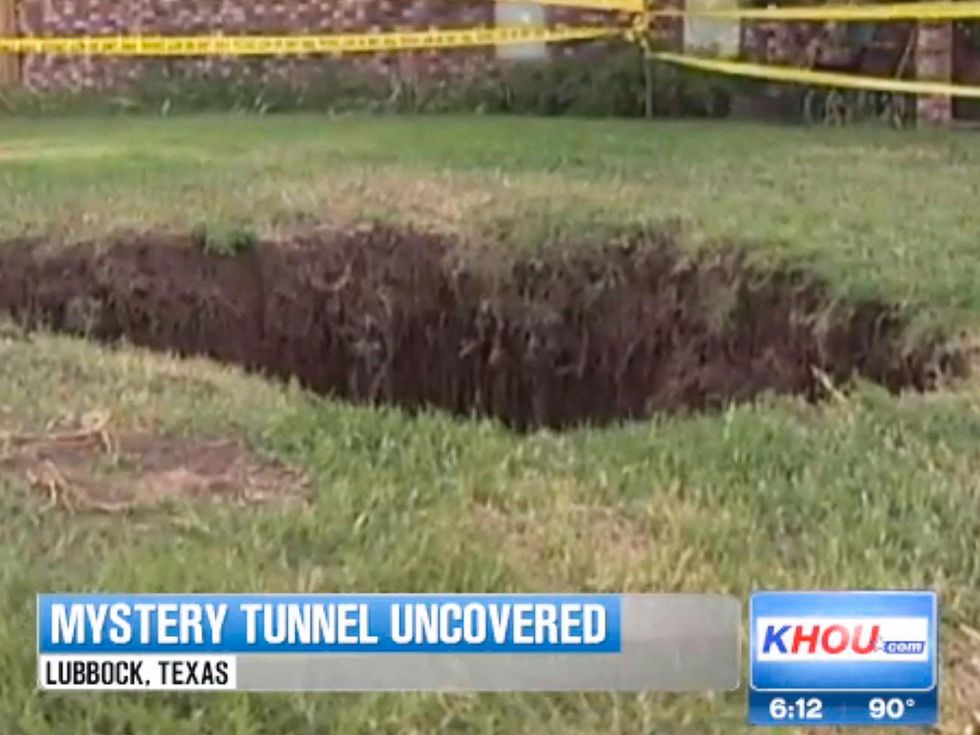 Lubbock man discovers hidden tunnel in back yard September 2013 with police tape