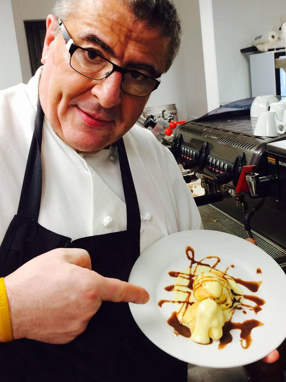 Luigi's Cucina Italiana Chef Luigi Ferre holding a desert