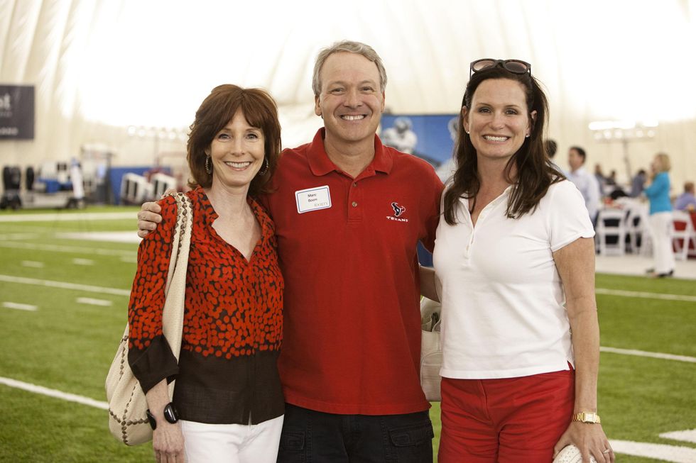 Marcy Taub, from left, Dr. Marc Boom and Cabrina Owsley at The Society for Leading Medicine Houston Texans Family Field Day May 2014