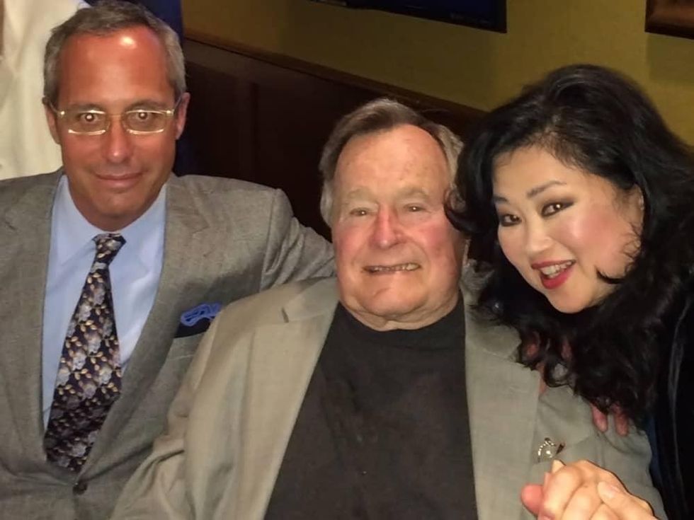 Mark Sullivan, from left, George H.W. Bush and Gigi Huang at the George H.W. Bush party April 2014