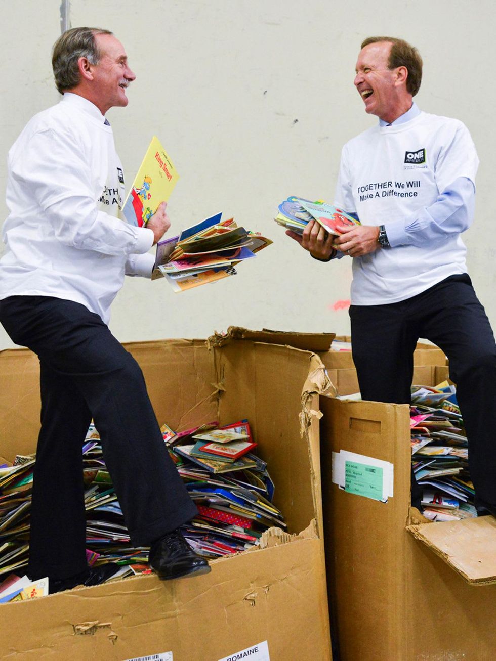 Marty Goossen, left, and Neil Bush at the Books Between Kids project November 2013