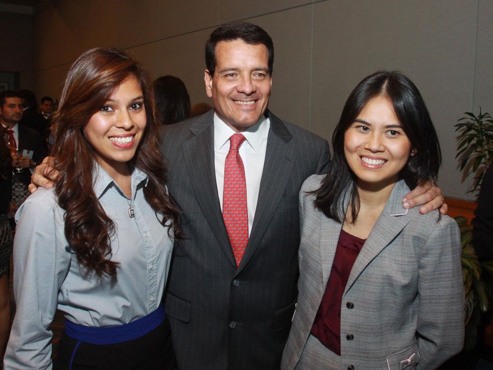 Mayra Magana, from left, Felipe Bayon and Huyen Do at the Emerging Leaders Institute 2013 class graduation.