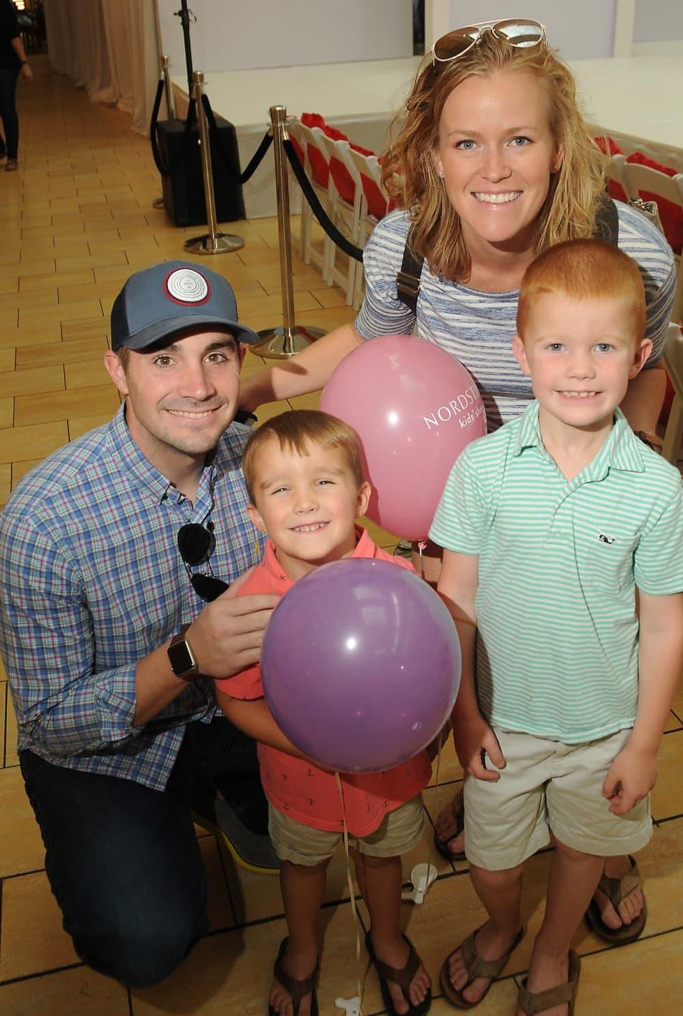 MD Anderson fashion show Steven and Chrissy Kinney with Grayson,7, and Cole,4,