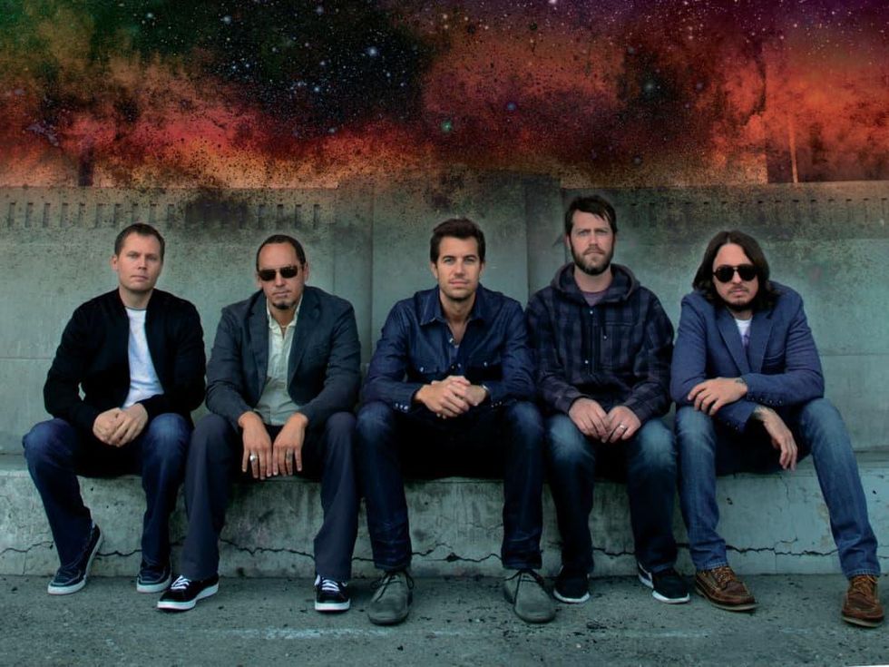 members of band 311 sitting down