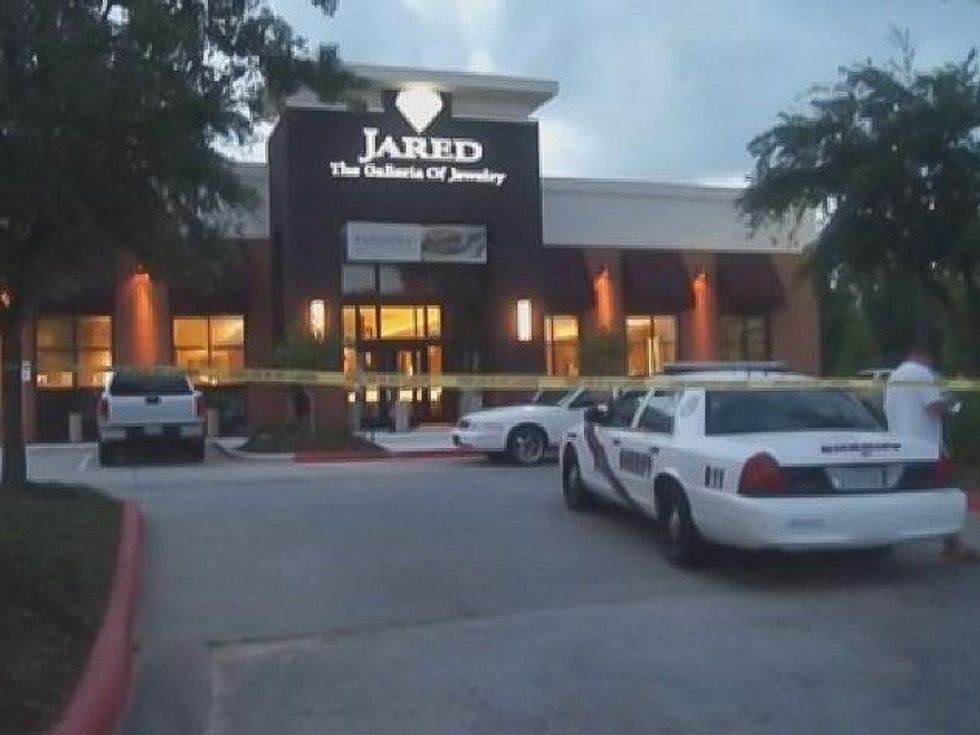 men in hazmat suits rob Jared's in The Woodlands June 2013 RUN FLAT