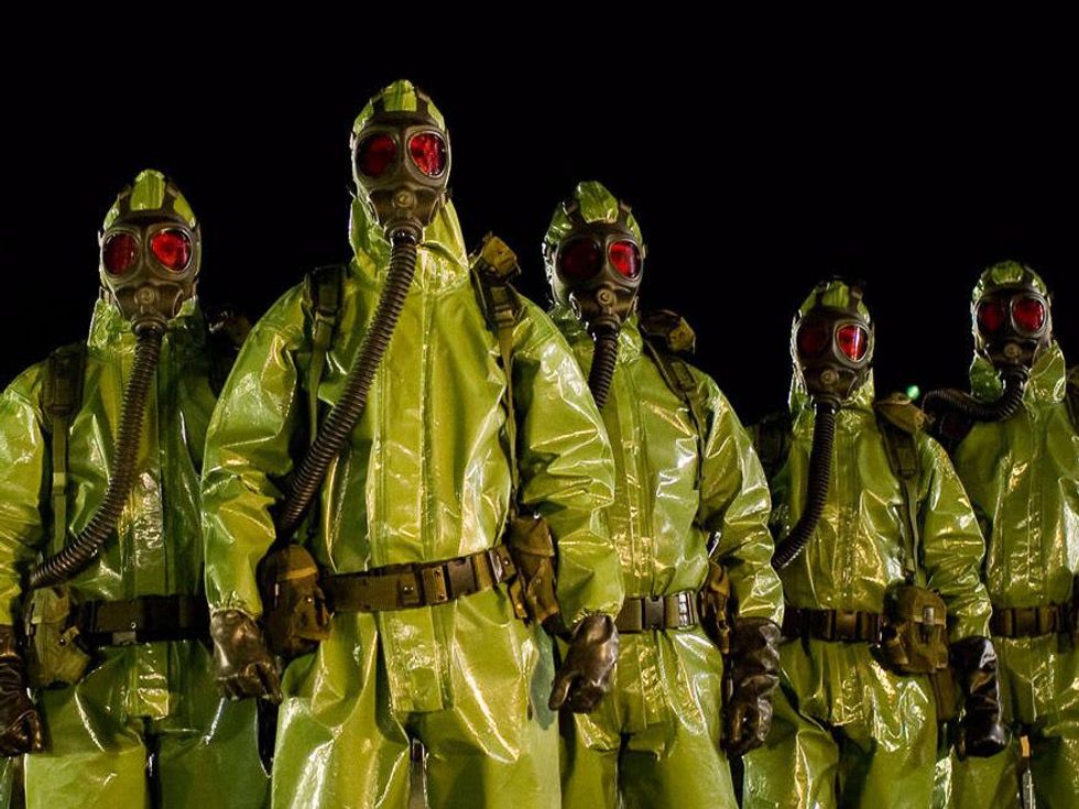 men in hazmat suits