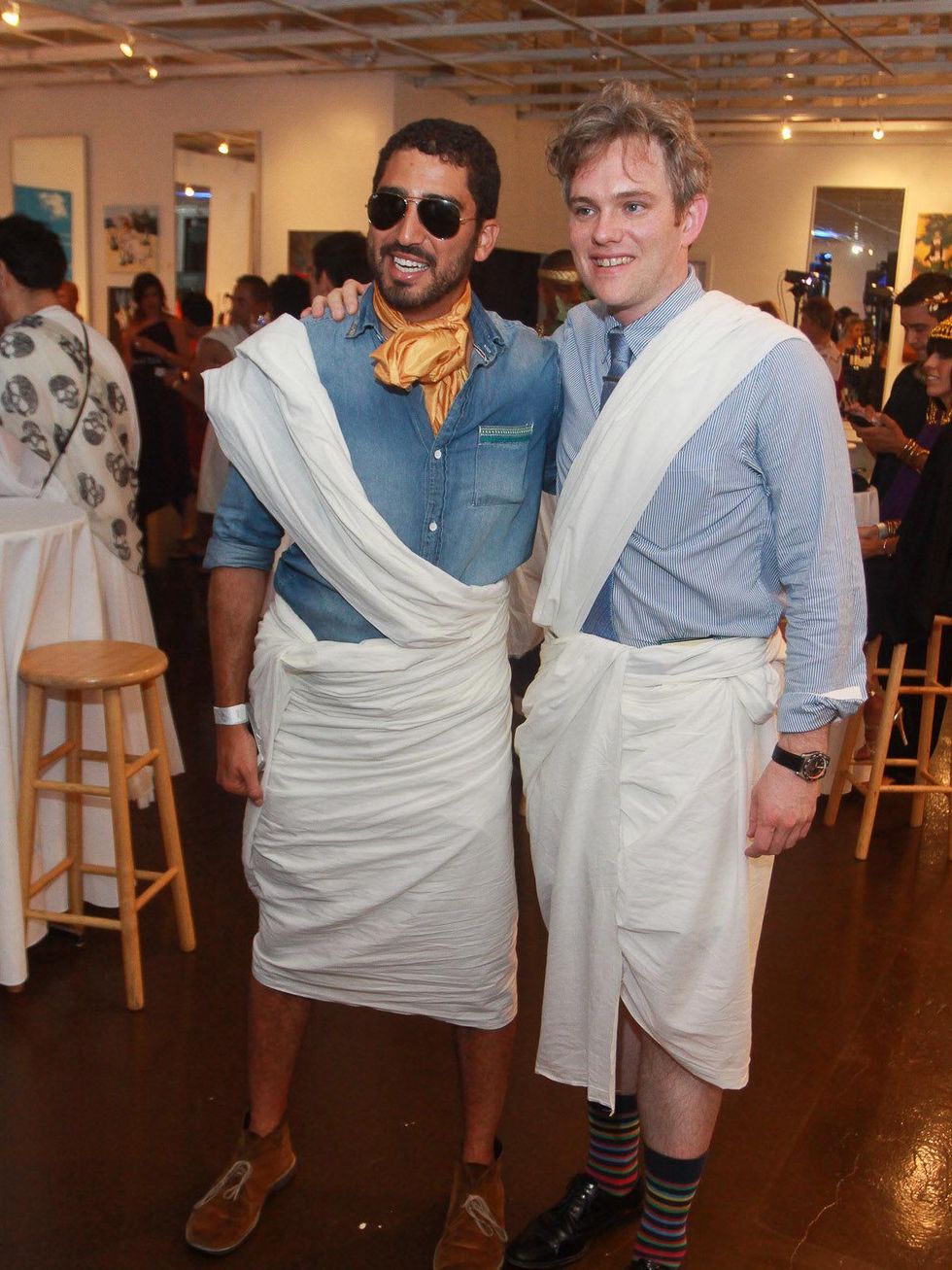 Mena Mark Hanna, left, and Robert Boldin at toga party at Craft Salon benefiting Bering Omega