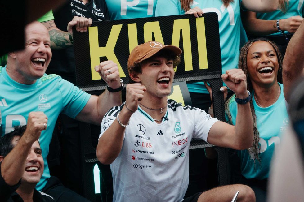Mercedes driver Kimi Antonelli celebrates his U.S. Grand Prix win with his team.