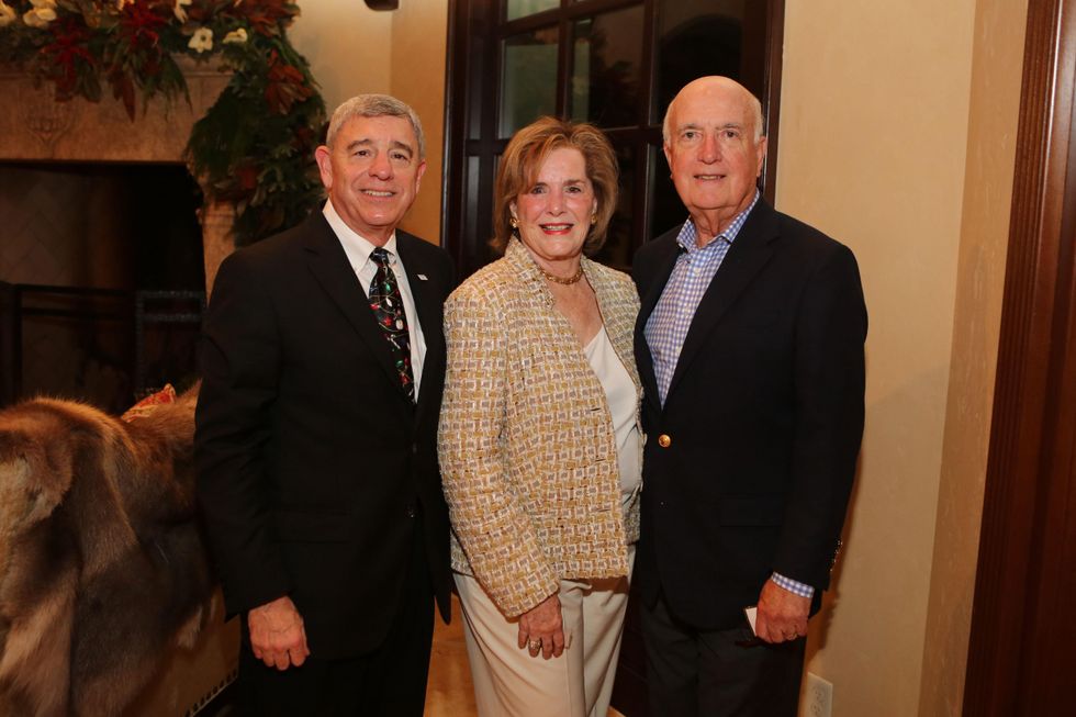 Michael Covert, left, with Pat and Tom Powers at St. Luke's holiday party December 2014