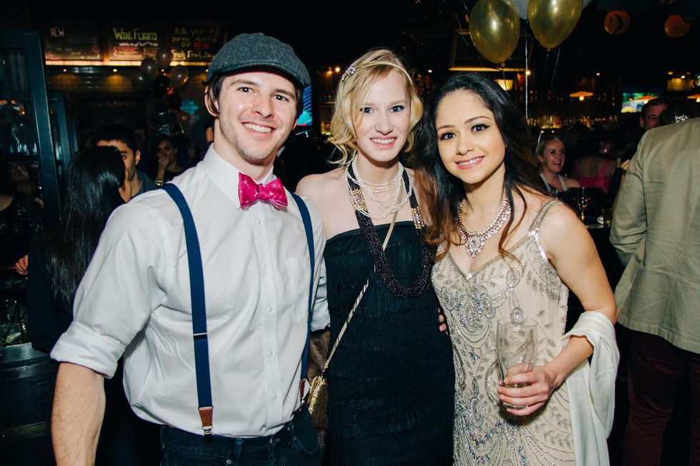 Michael Drone, from left, Welsley White and Ember Hull at New Year's Eve at Local Pour January 2015