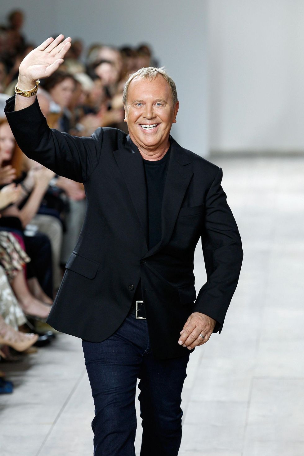 Michael Kors on the runway after showing of his spring collection