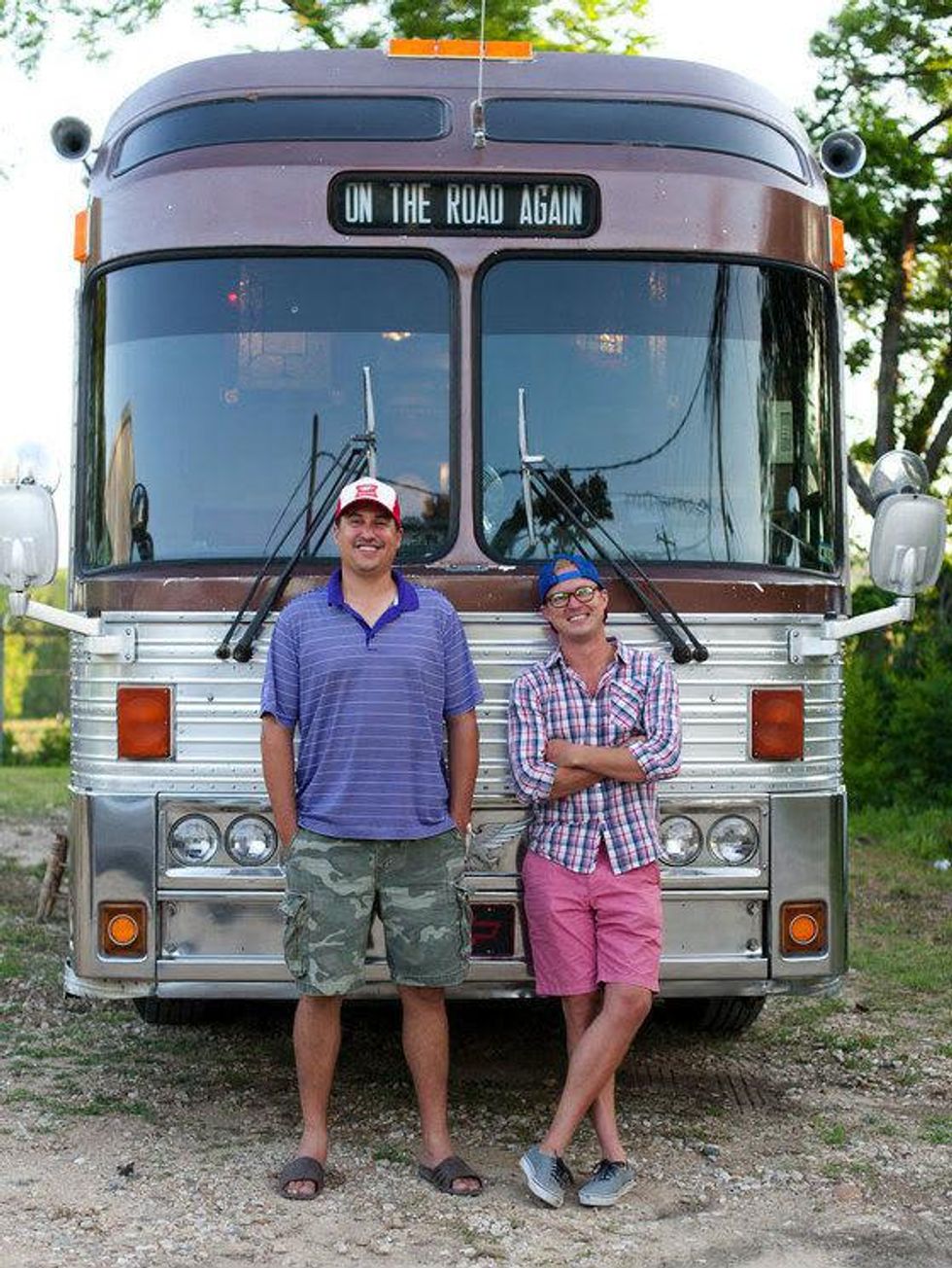 Michael Tashnick and Taylor Perkins standing in front of Willie Nelson tour bus