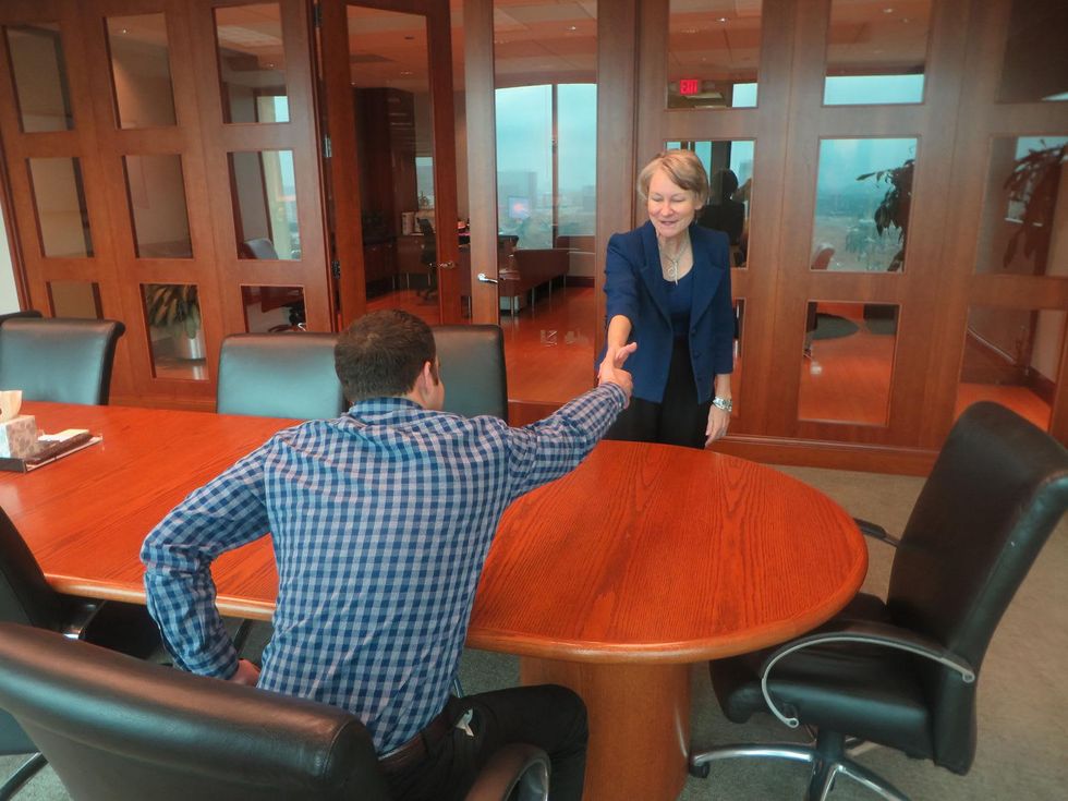 millenials in the workplace Jane Howze shaking hands with young man