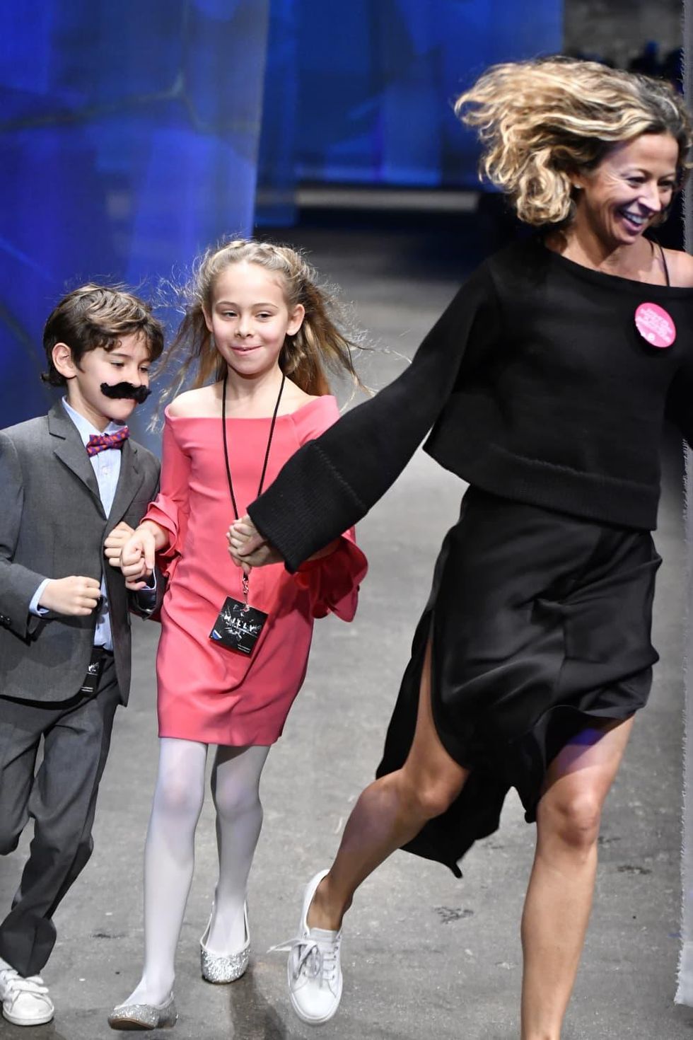 Milly designer Michelle Smith and children at end of fall 2017 runway show
