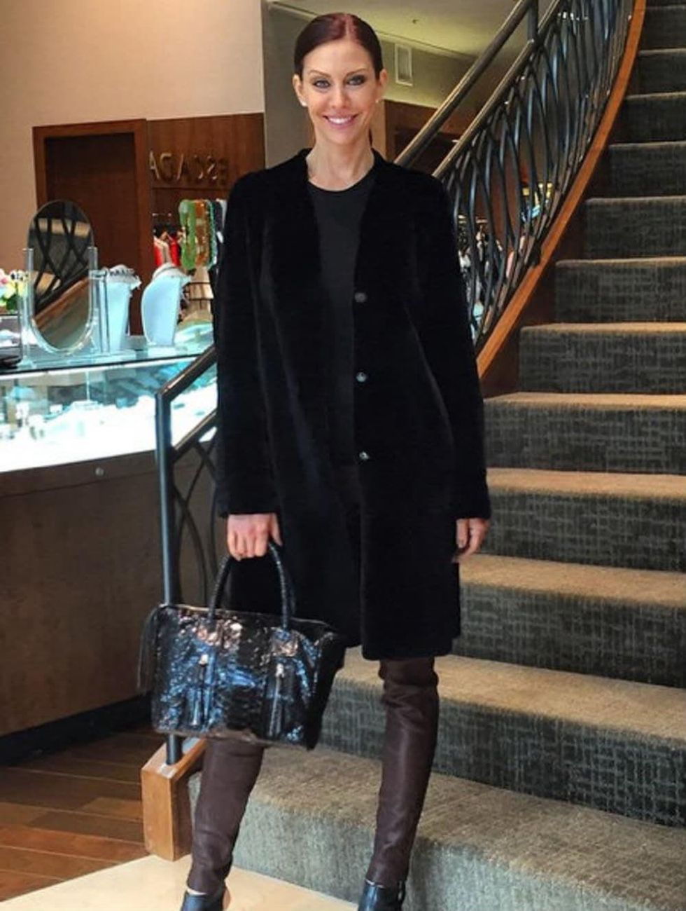 Model in outfit and Carlos Falchi handbag at Elizabeth Anthony