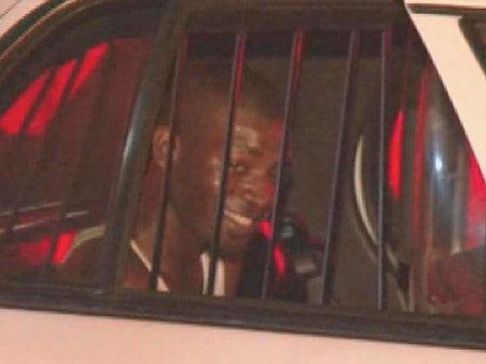 Molotov cocktail into apartment Houston fire damage May 2013 suspect arrested and smiling in police car