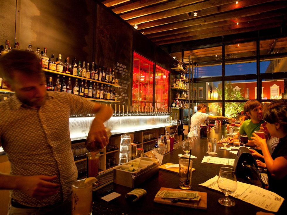 Mongoose Versus Cobra bar Houston people at bar with bartender