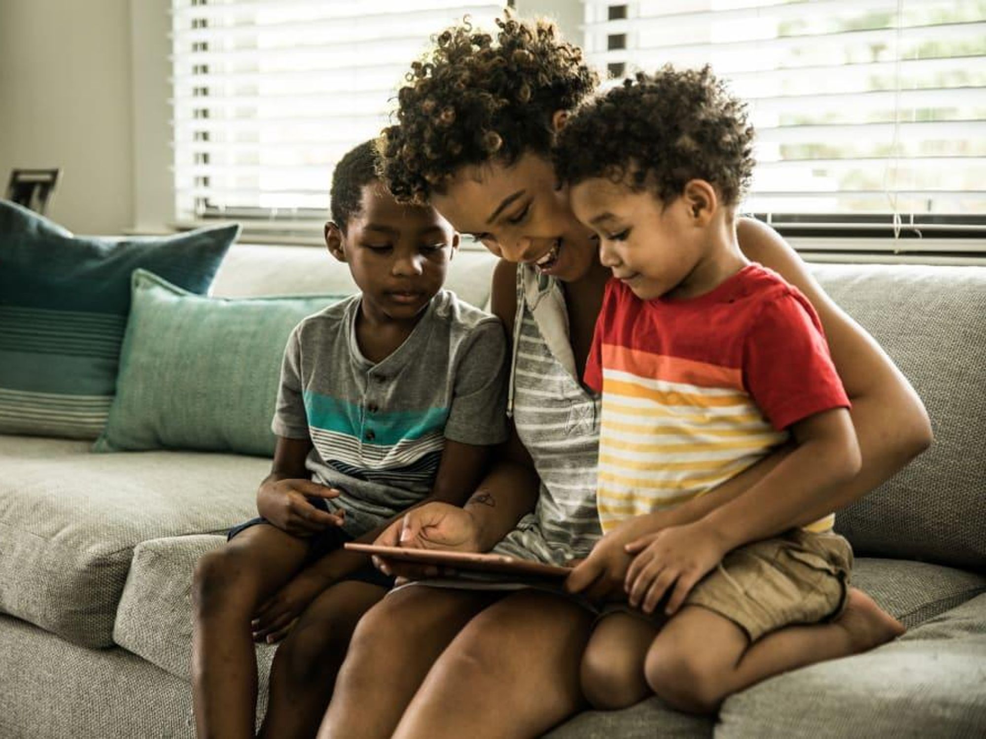 Mother and children using tablet