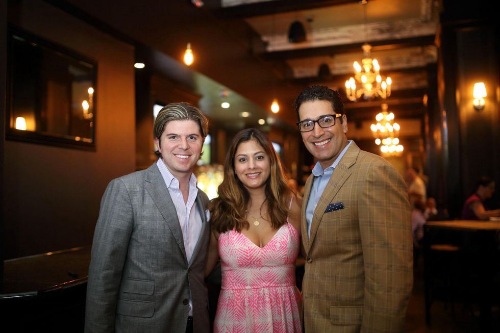 Nathan Reedy, from left, Katherine Ross and Josh Espinedo at the Springbok restaurant kick-off party July 2014