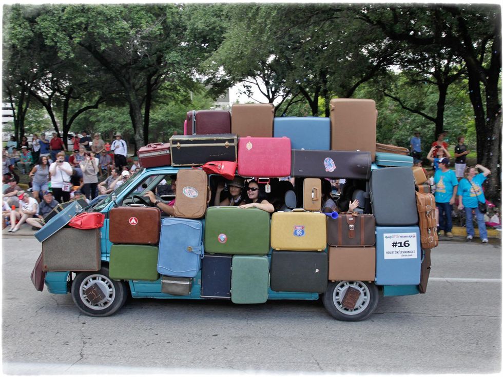 News_Art Car Parade_Sandra Bello_couch surfing suitcase_Banana car_May 2012