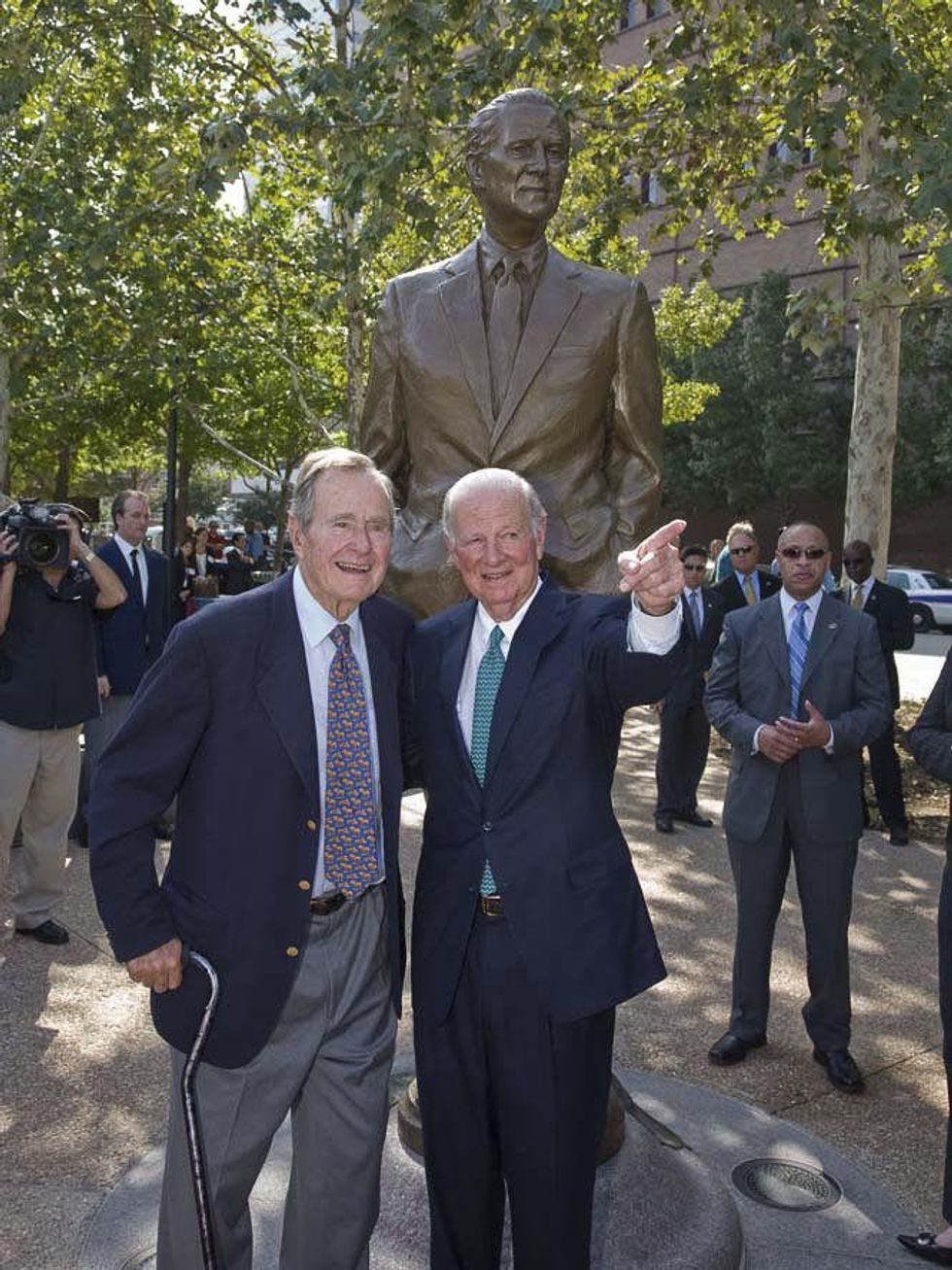 An 8-foot-tall James A. Baker III looks up to George H.W. Bush on the ...