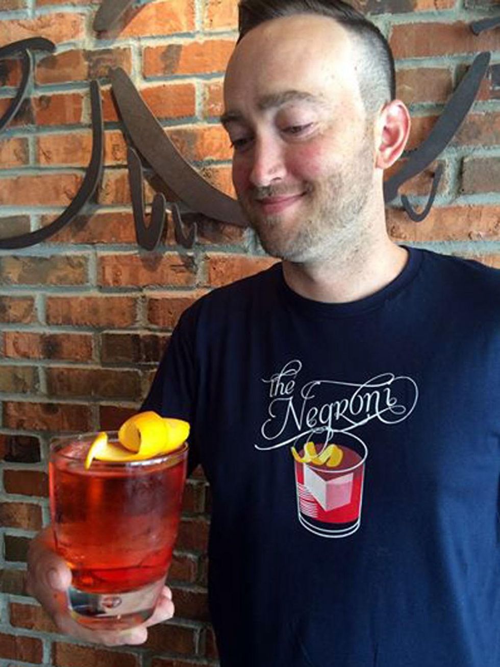 News_Ellen Goodacre_Ravenous Pig Bartender holds Negroni_June 2014