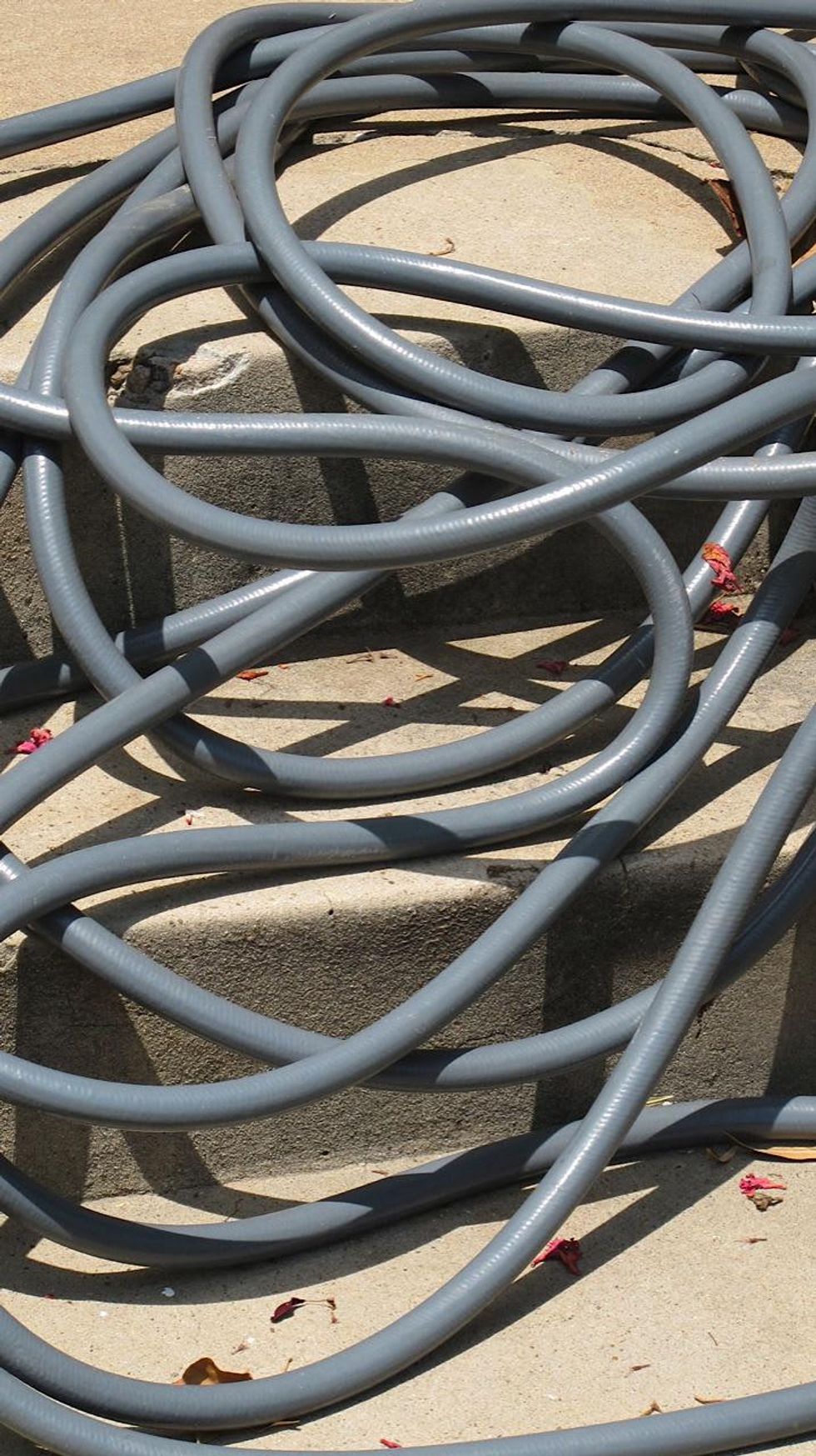 News_Katie_a water hose rogue_May 2012_6_pile of giant, rubber-made spaghetti.jpg
