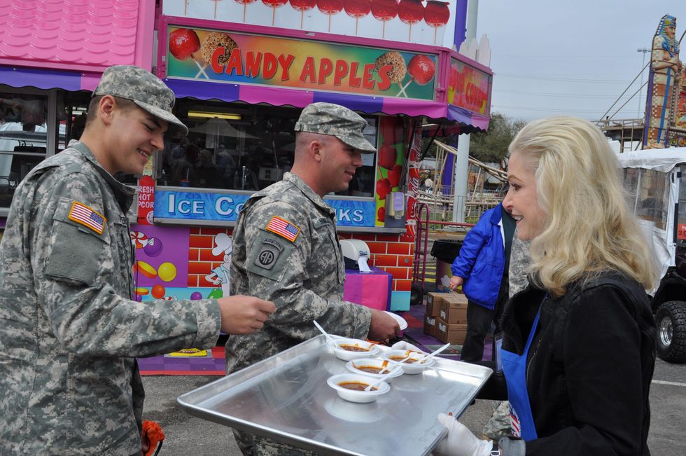 News, Shelby, Carrie Carr serves chili, Rodeo Armed Services Day, March 2014