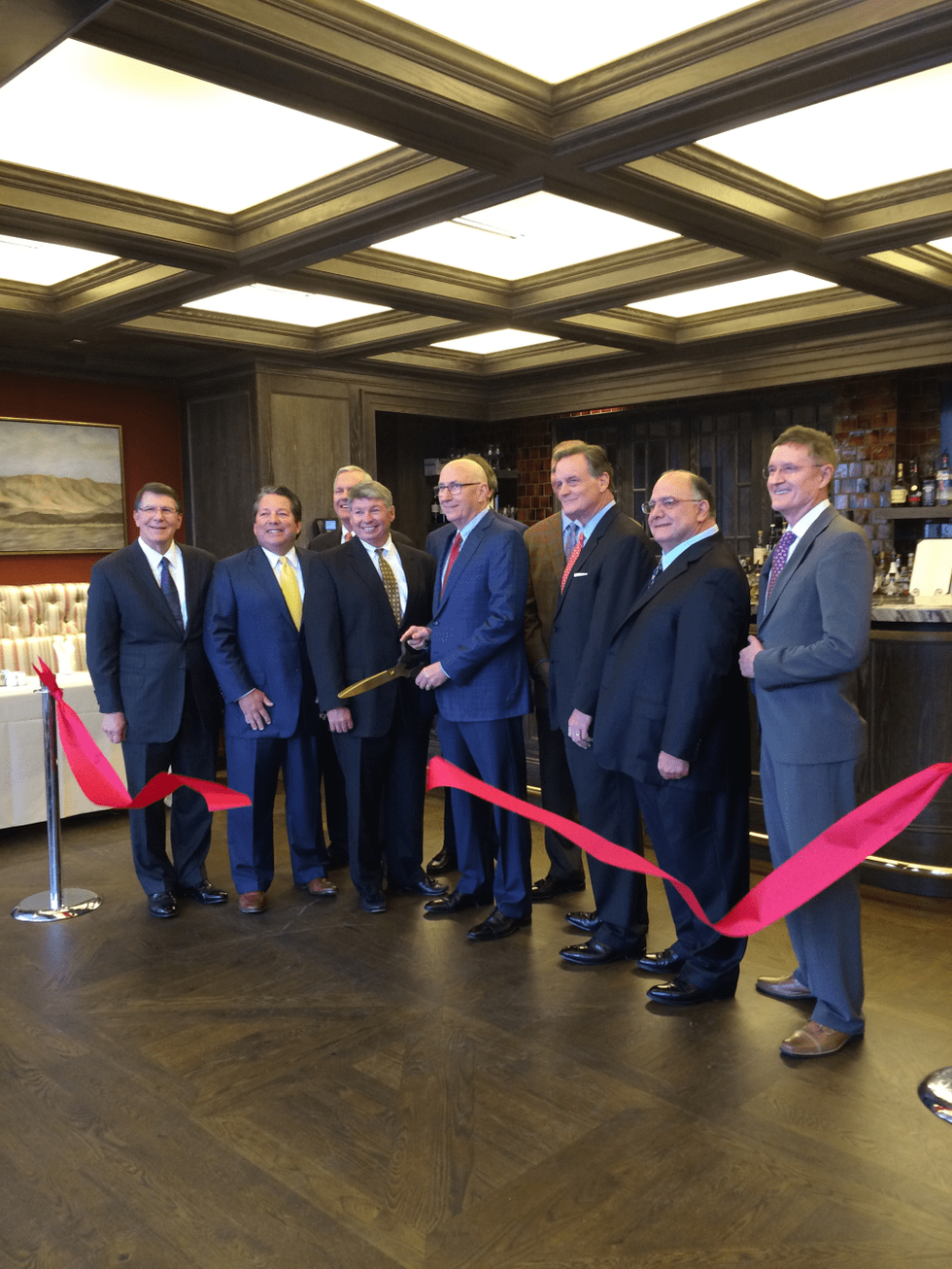 News, Shelby, Petroleum Club Bayou Bengal Bar, June 2015, Jeff Lester, Matt McCarroll, John Havens, Jud Grady, Ron Neal (with scissors), Billy Harrison (hidden behind Neal), Keith Jordan, Marty Phillips, Clarence Cazalot, Phil Martin