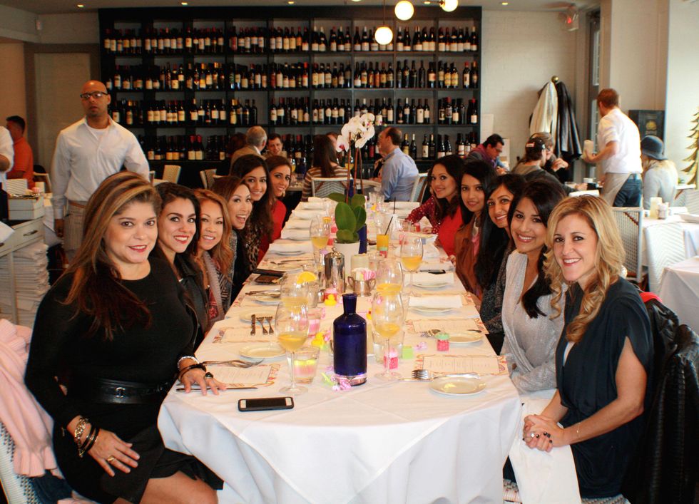 Marcy de Luna, left, and Courtney Zubowski flank Rekha Muddaraj at