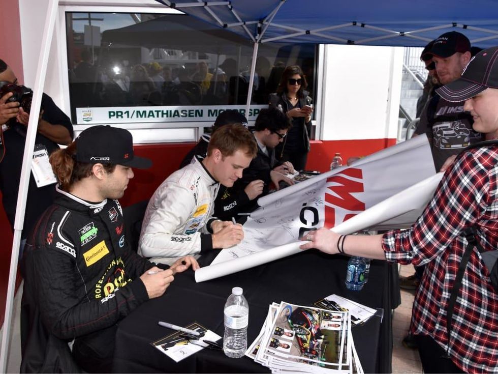 Nick Boulle signing autographs at Rolex 24 at Daytona