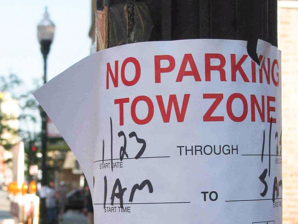 no parking sign, telephone pole