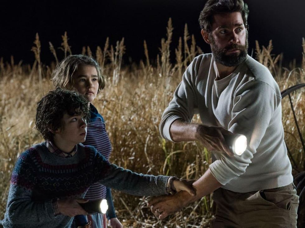 Noah Jupe, Millicent Simmonds, and John Krasinski in A Quiet Place