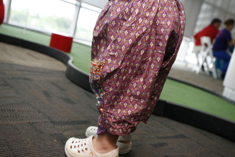 One of the Perkins sextuplets shows off his puffy pants designed by mom Lauren at the Bad Pants Open kick-off party at Texas Children's Hospital.