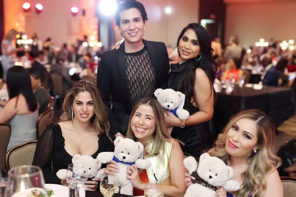 Operation Smile Gala 2021 Yasmine Kateb (left), Angel Woolsey, and party guests