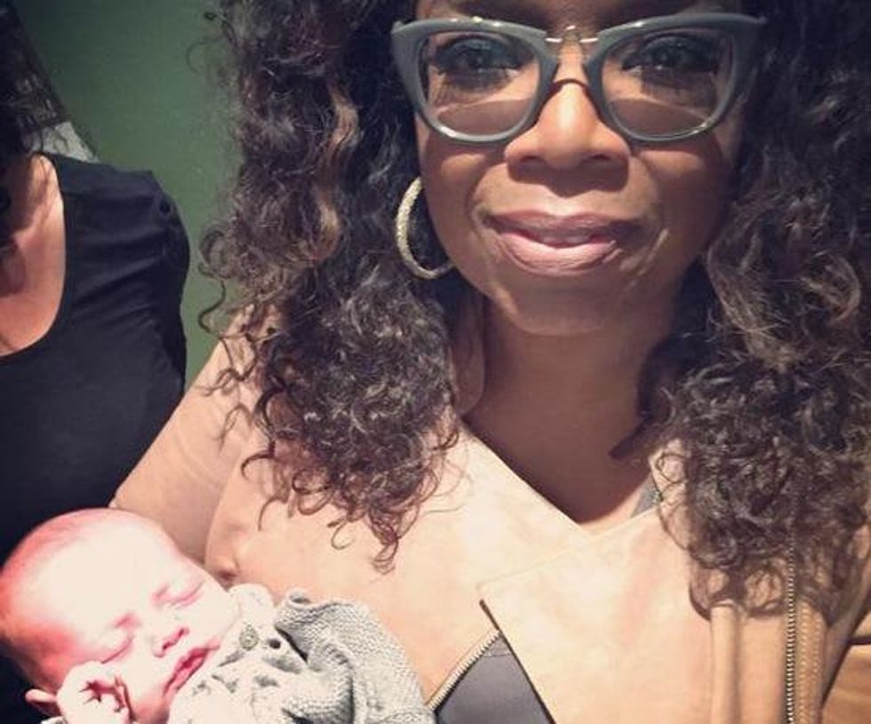 Oprah WInfrey with Caswell baby at Reef