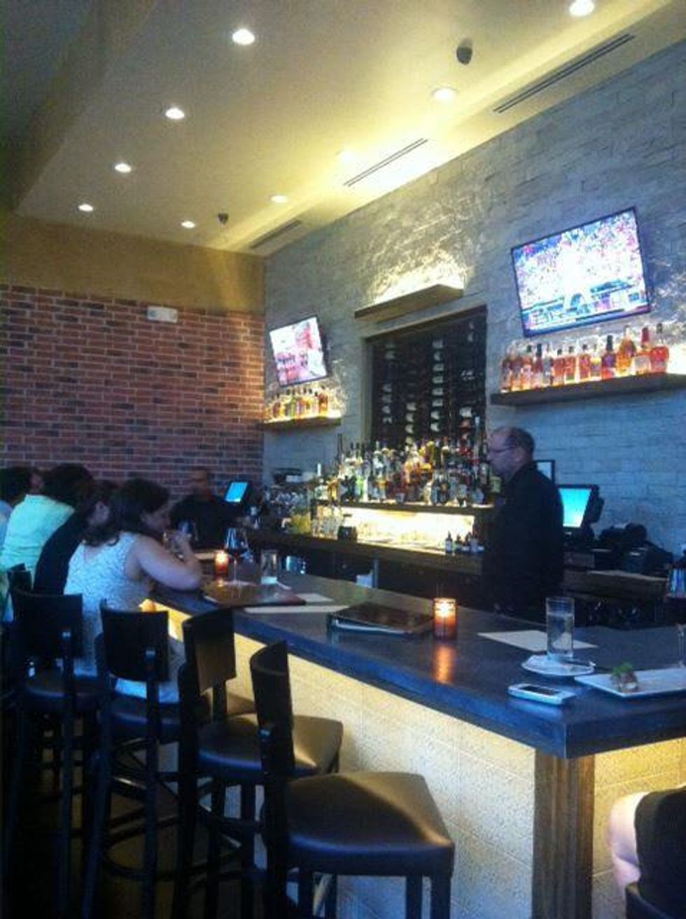 Osteria Mazzantini bar with first guests August 2013