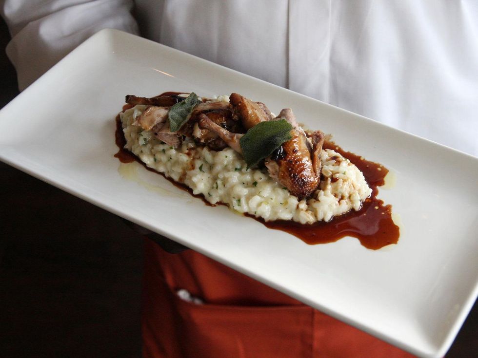 Osteria Mazzantini Hill Country Quail on herbed risotto with huckleberry demi