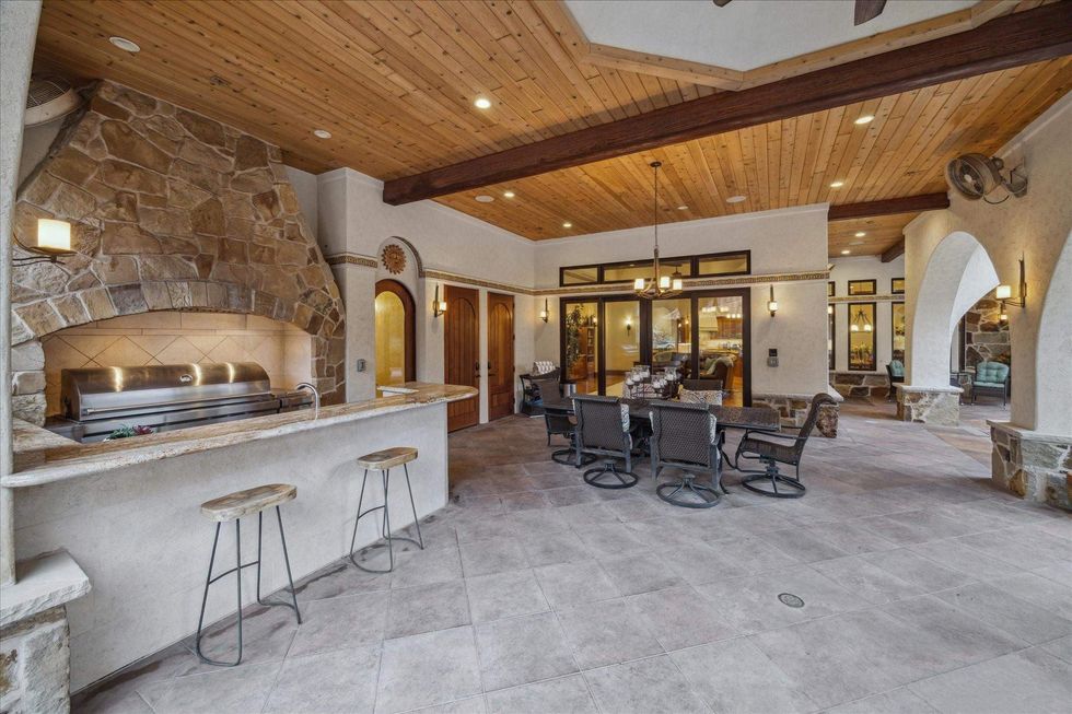 Outdoor patio and summer kitchen of 21538 Mueschke Road