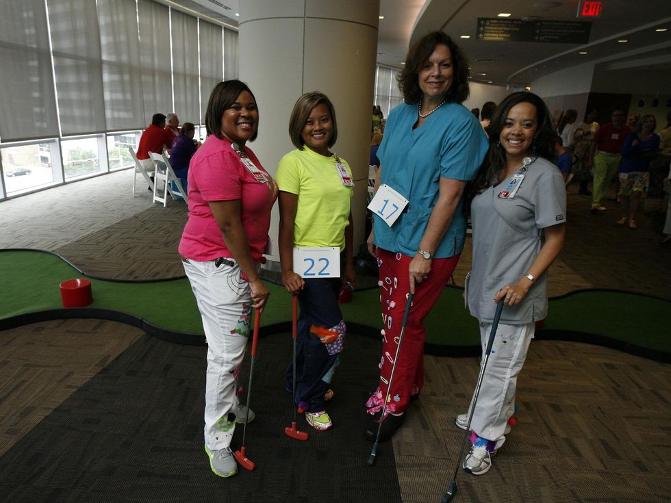 Participants in the Bad Pants Open kick-off party at Texas Children's Hospital