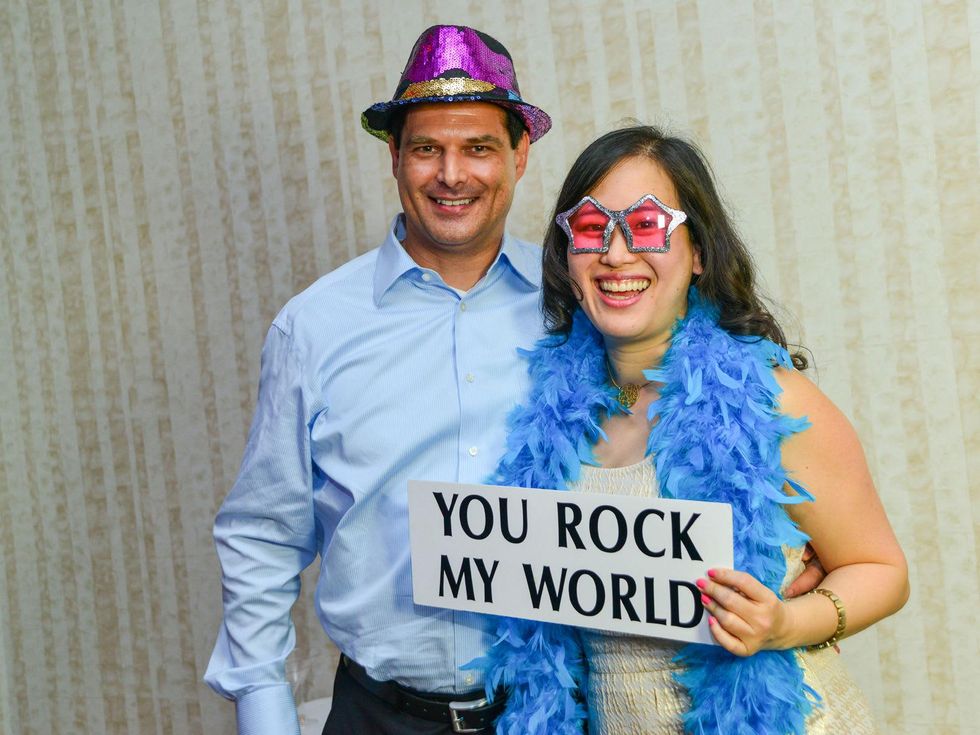 Party-goers having fun in the photo booth at the Young Professionals Backstage party January 2014