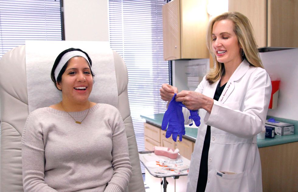 Patient and doctor smiling in medical office