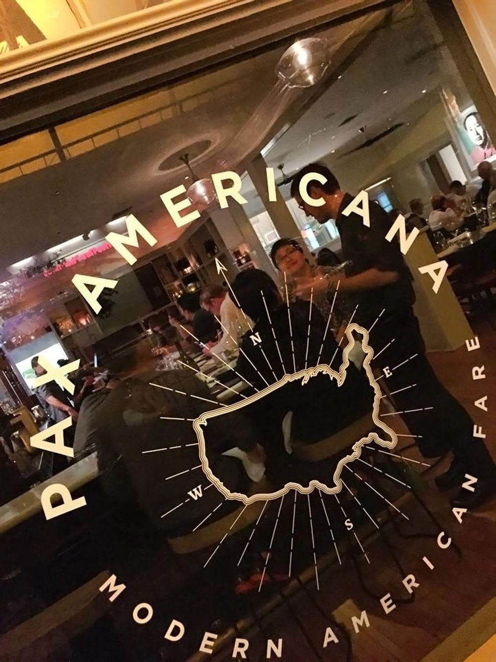 Pax Americana sign on window looking inside November 2014
