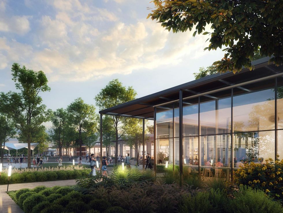 People at twilight mingle in a community space.